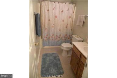 7250 Mackall Road St. Leonard, MD 20685 - Photo 17 of 27 a bathroom with a sink and a mirror