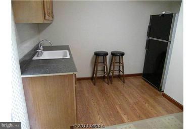 7250 Mackall Road St. Leonard, MD 20685 - Photo 9 of 27 a room with two washing machine