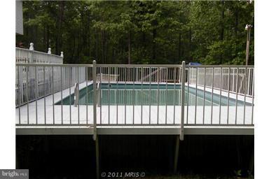 7250 Mackall Road St. Leonard, MD 20685 - Photo 10 of 27 a view of deck and wooden fence