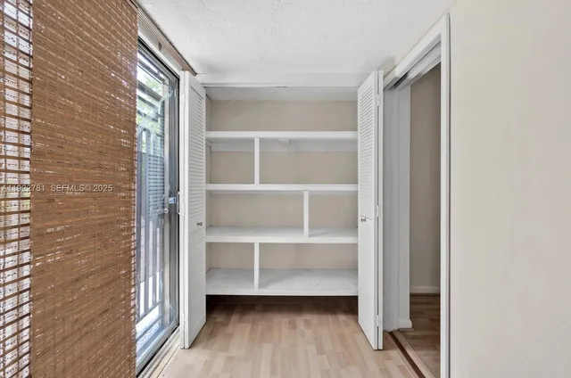 a view of front door with wooden floor