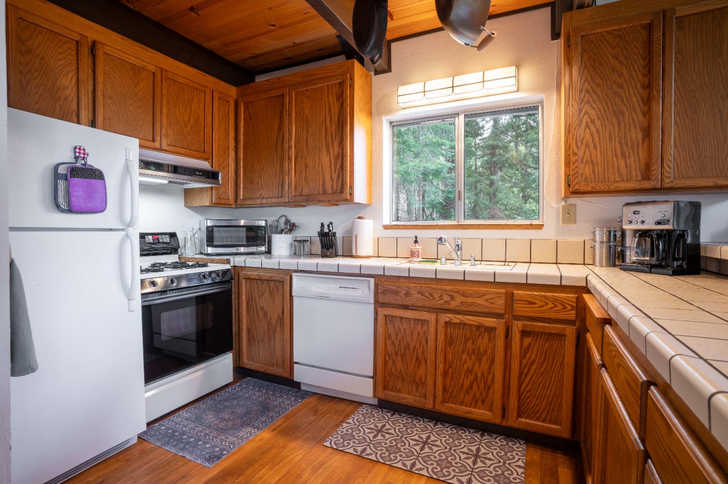 3790 Apache Road Arnold, CA 95223 - Photo 8 of 41 a kitchen with stainless steel appliances granite countertop a sink a stove and a refrigerator