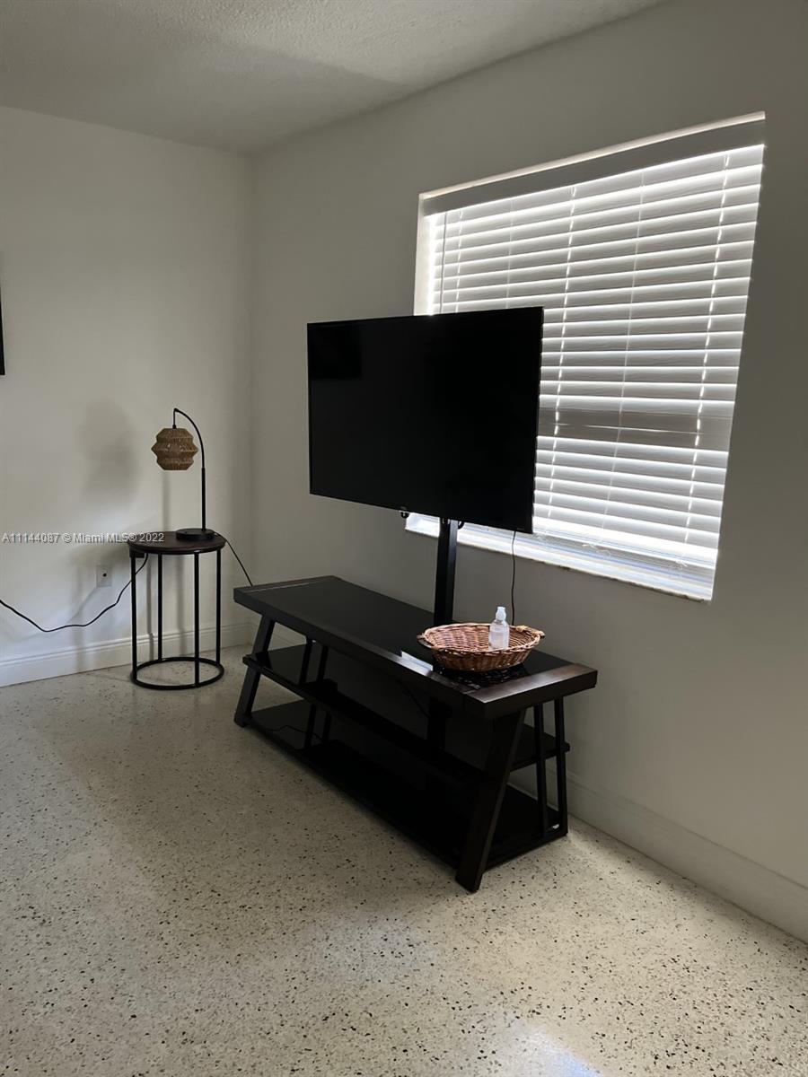 442 Southwest 9th Street, Unit 3 Miami, FL 33130 - Photo 10 of 10 a living room with furniture and a flat screen tv
