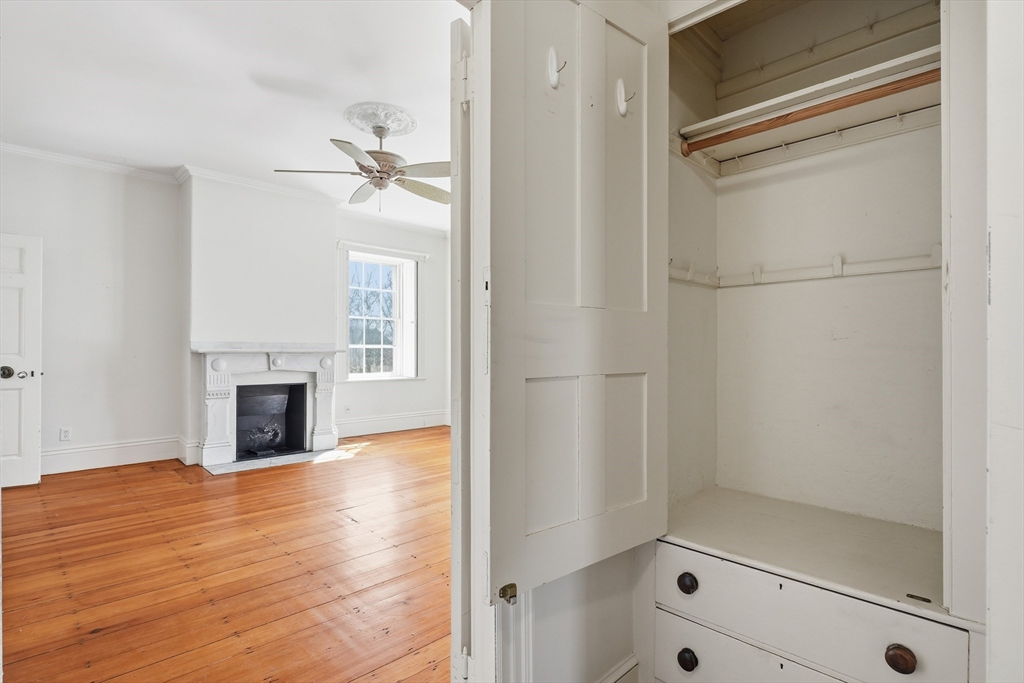 96 Washington Square East, Unit 2 Salem, MA 01970 - Photo 11 of 40 a view of a livingroom with wooden floor and a fireplace