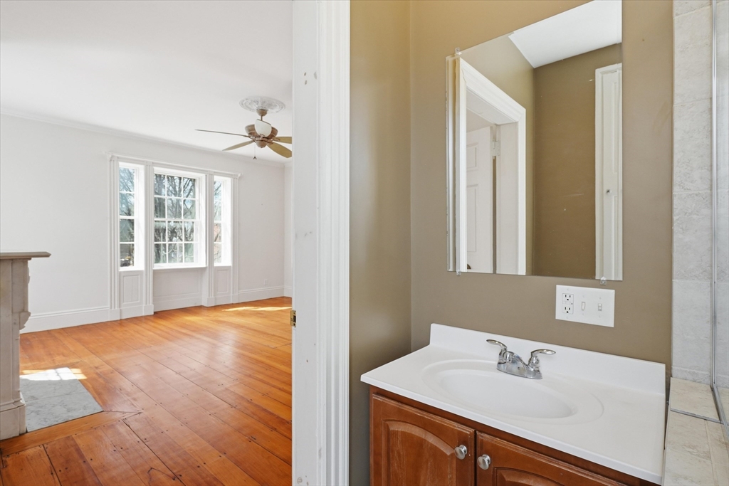 96 Washington Square East, Unit 2 Salem, MA 01970 - Photo 18 of 40 a bathroom with a sink mirror and a window