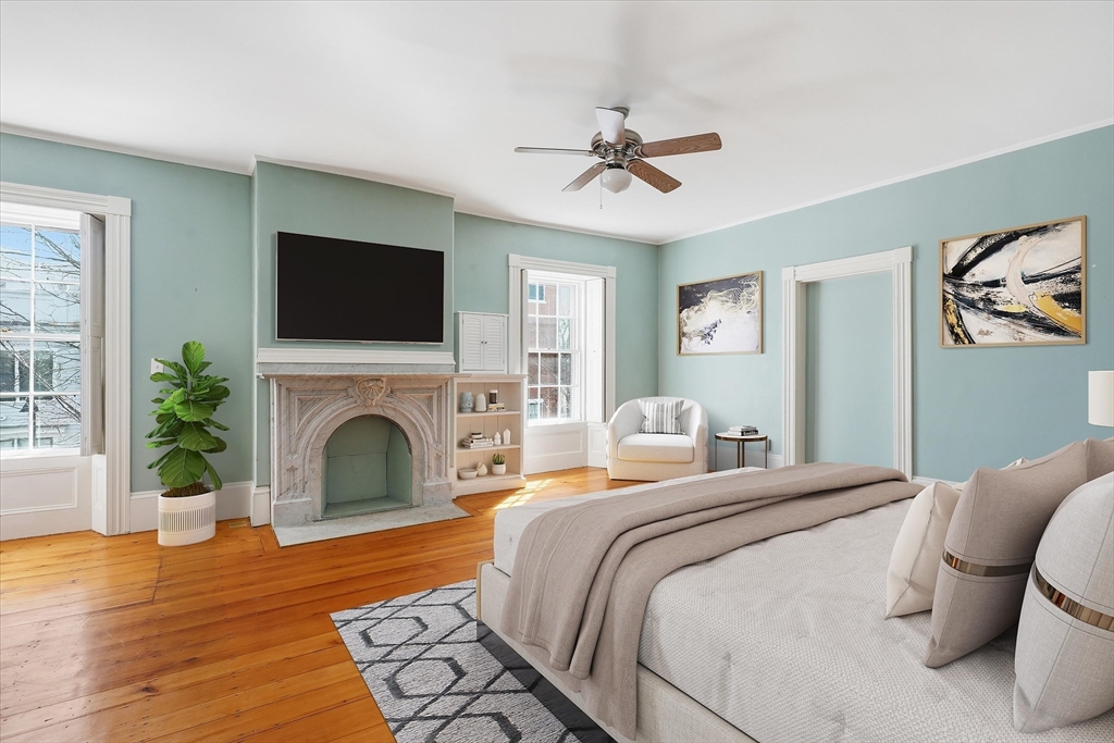 96 Washington Square East, Unit 2 Salem, MA 01970 - Photo 28 of 40 a bedroom with a bed and a flat screen tv
