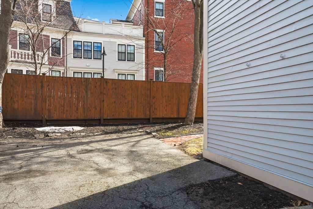 96 Washington Square East, Unit 2 Salem, MA 01970 - Photo 30 of 40 a view of a house with a backyard