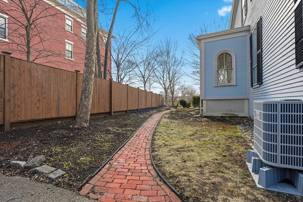 96 Washington Square East, Unit 2 Salem, MA 01970 - Photo 31 of 40 a front view of a house with garden