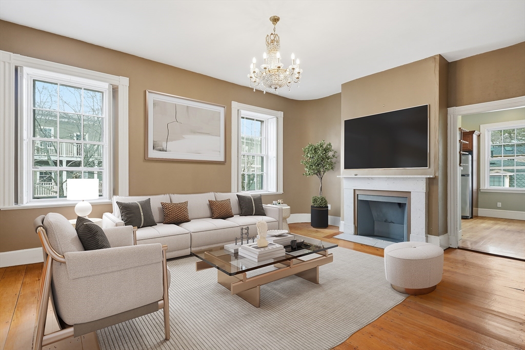 96 Washington Square East, Unit 2 Salem, MA 01970 - Photo 4 of 40 a living room with furniture a fireplace and a flat screen tv