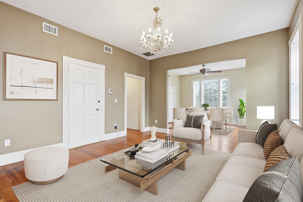 96 Washington Square East, Unit 2 Salem, MA 01970 - Photo 5 of 40 a living room with furniture and a chandelier
