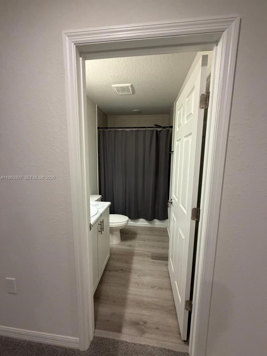 415 Crossings Avenue St. Cloud, FL 34771 - Photo 12 of 17 a bathroom with a sink and a mirror