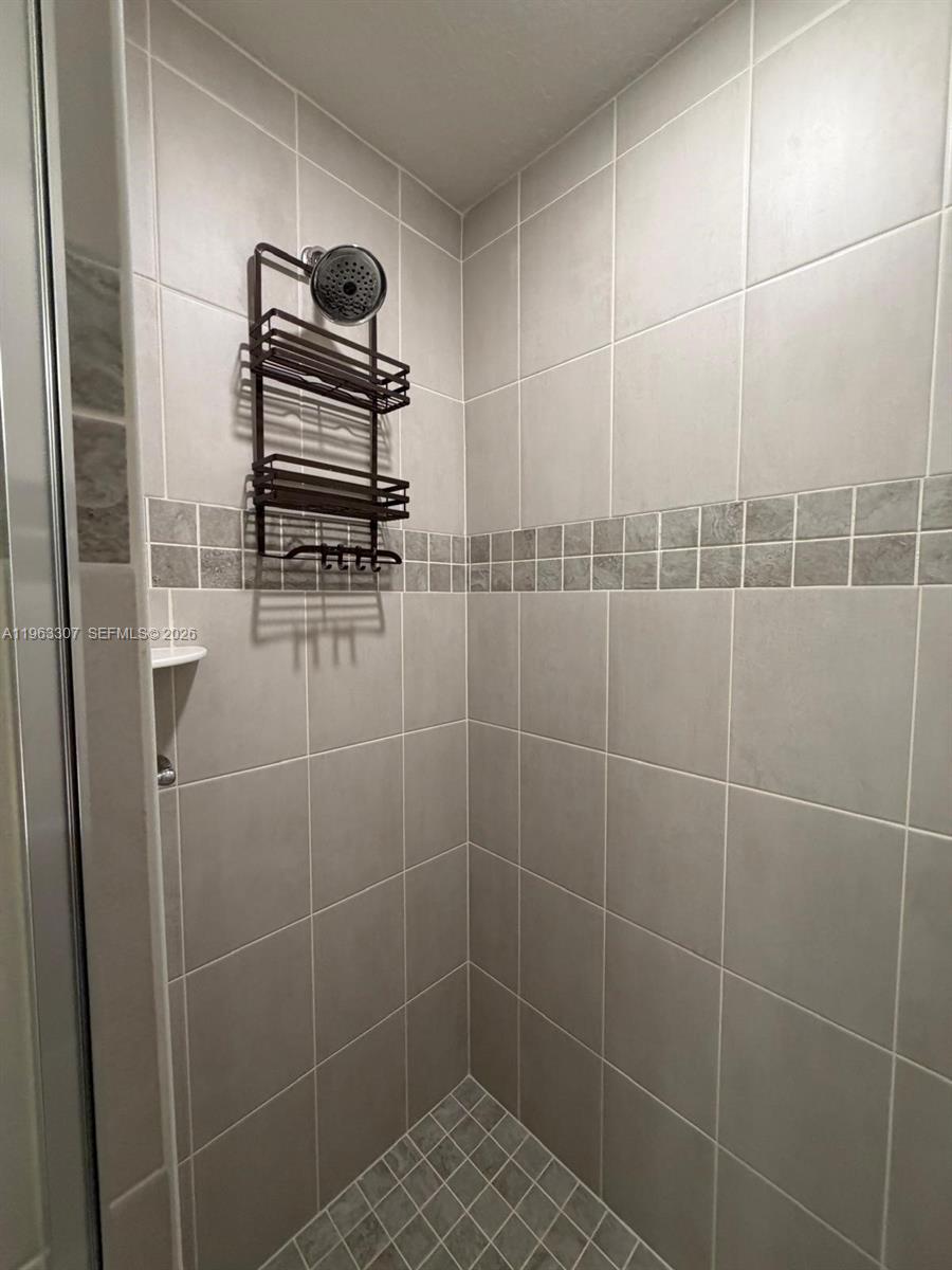 415 Crossings Avenue St. Cloud, FL 34771 - Photo 14 of 17 a bathroom with a shower