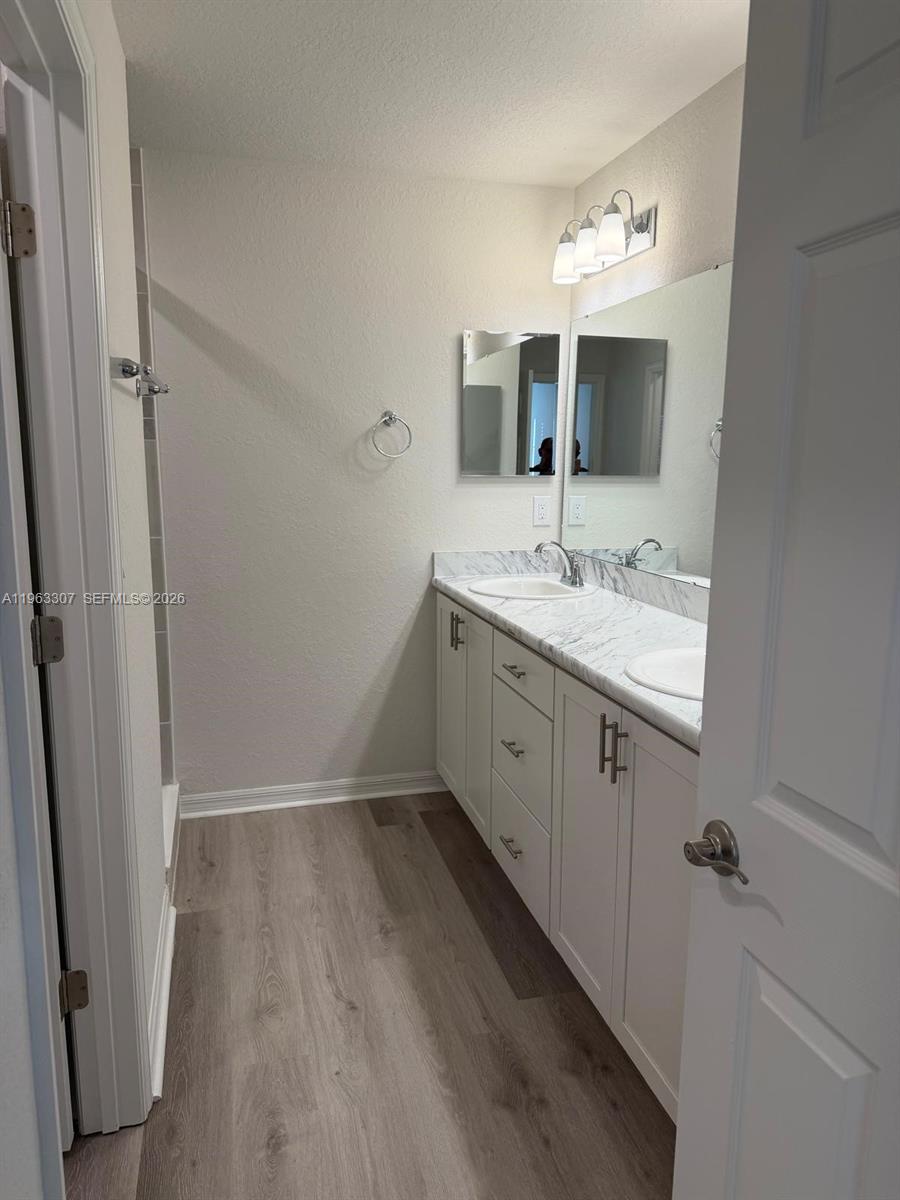 415 Crossings Avenue St. Cloud, FL 34771 - Photo 15 of 17 a bathroom with a sink and mirror