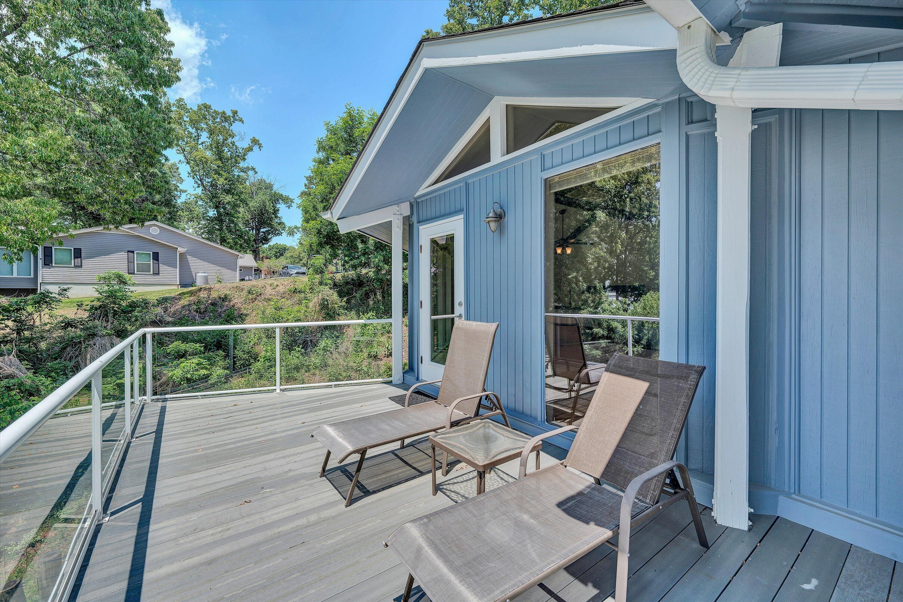 207 Winding Way Union Hall, VA 24176 - Photo 20 of 60 a view of a patio with table and chairs and wooden floor