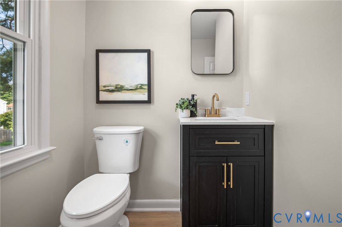 8928 Hawkbill Road North Chesterfield, VA 23237 - Photo 32 of 50 White window trim, white commode, dark wood-finish