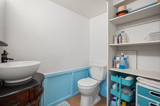 149 West 1600th Street South Mapleton, UT 84664 - Photo 28 of 44 Bathroom with vanity, a wainscoted wall, and a decorative wall