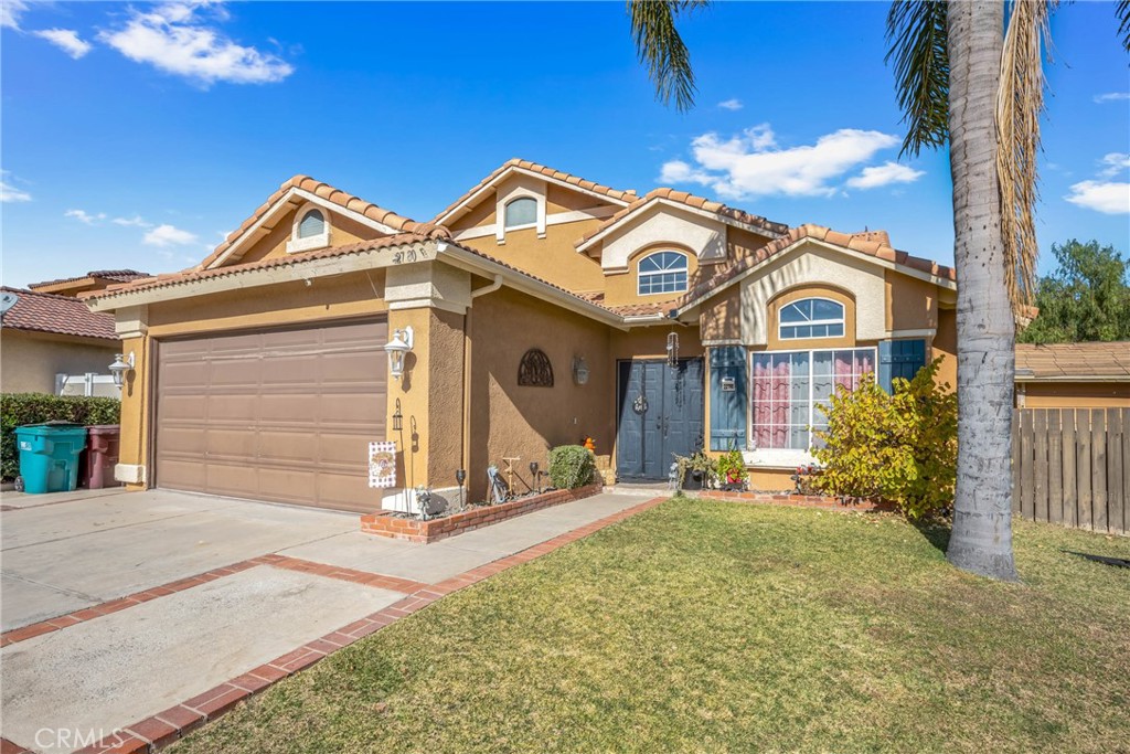 22780 Countryside Way Moreno Valley, CA 92557 - Photo 1 of 1 a view of a house with a yard and plants