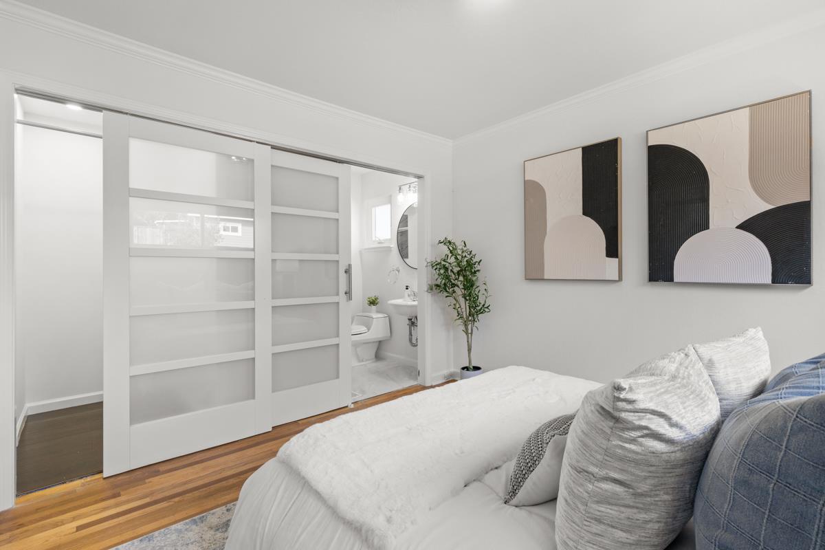 383 Monterey Road Pacifica, CA 94044 - Photo 12 of 33 a bedroom with a large bed and a closet