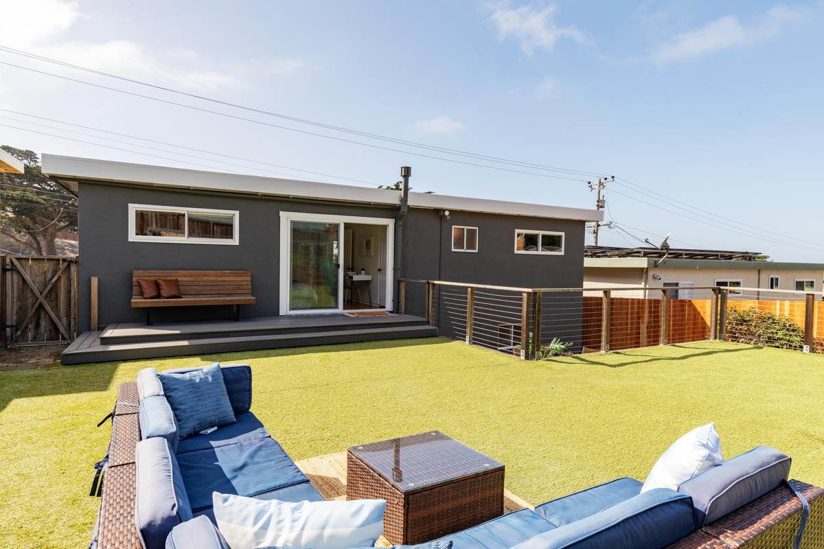 383 Monterey Road Pacifica, CA 94044 - Photo 23 of 33 a swimming pool with outdoor seating and yard