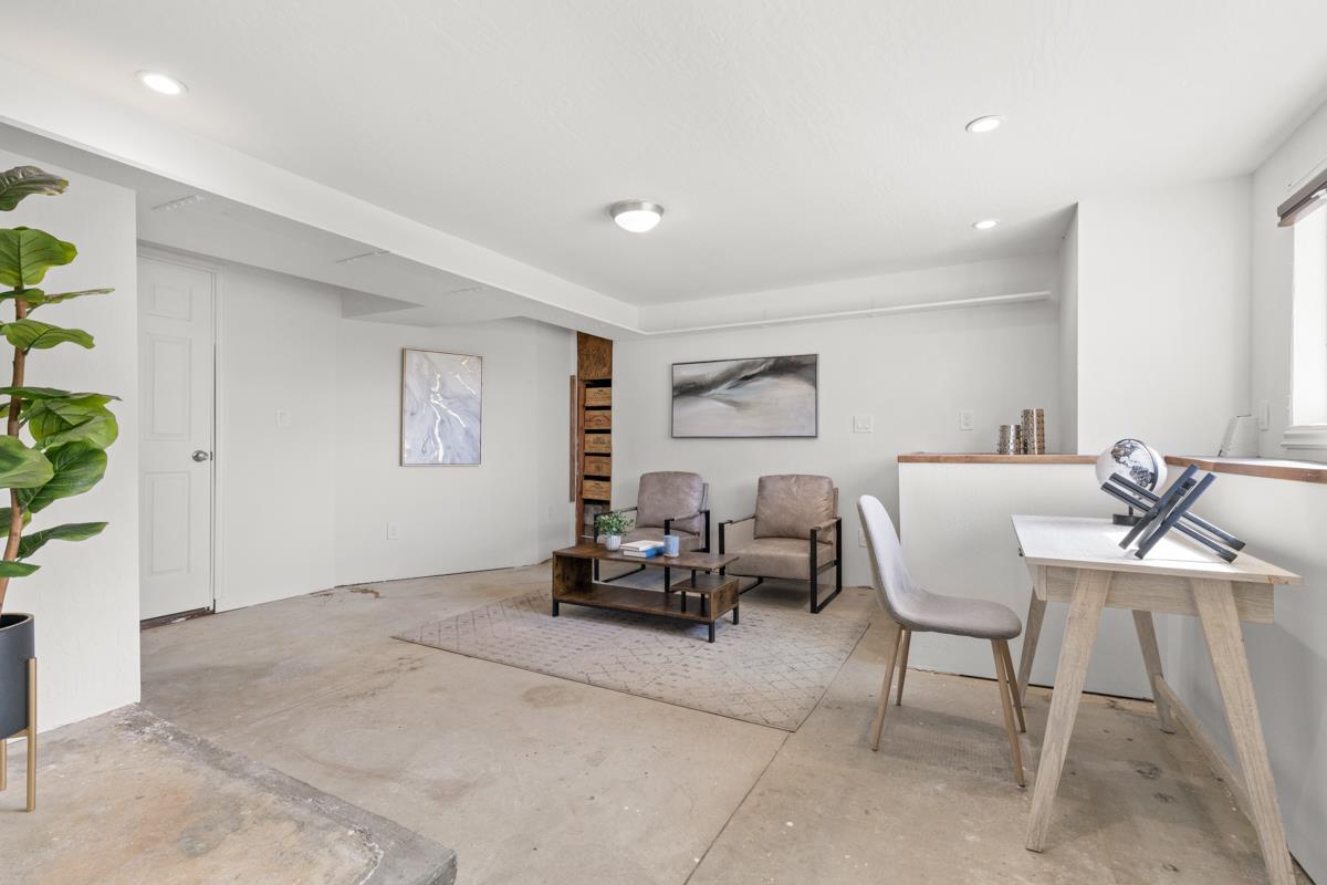 383 Monterey Road Pacifica, CA 94044 - Photo 27 of 33 a living room with furniture and a potted plant