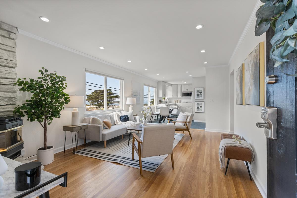 383 Monterey Road Pacifica, CA 94044 - Photo 3 of 33 a living room with furniture or wooden floor and a potted plant