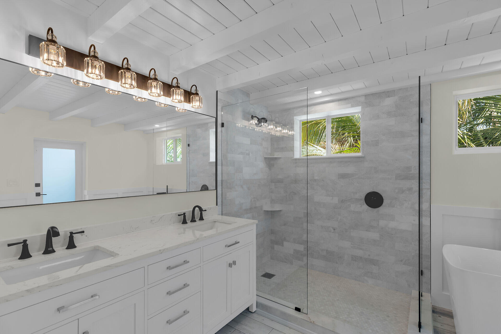 147 Sioux Street Tavernier, FL 33070 - Photo 17 of 41 a bathroom with a granite countertop sink a mirror and shower