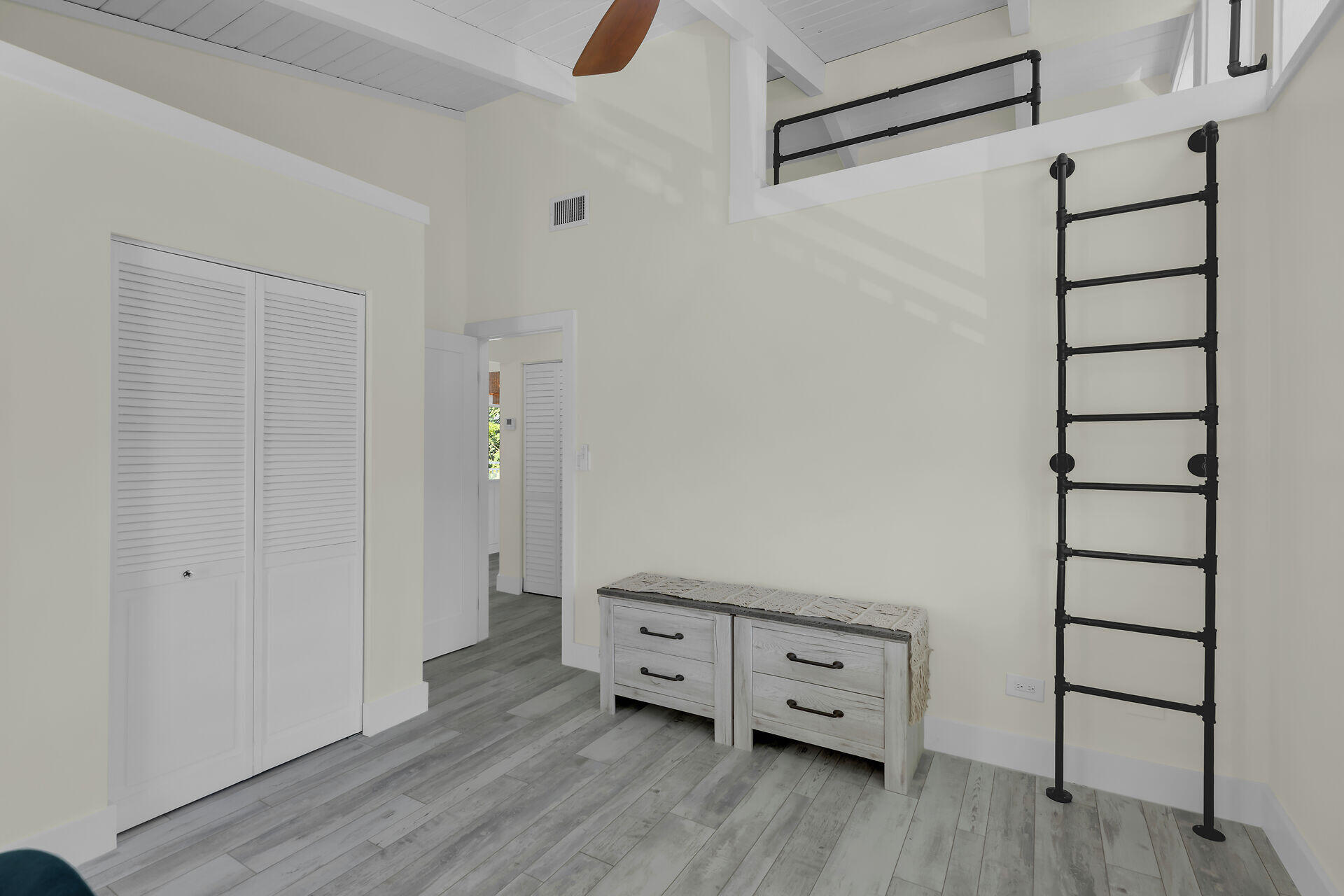 147 Sioux Street Tavernier, FL 33070 - Photo 24 of 41 a view of a hallway with wooden floor and closet