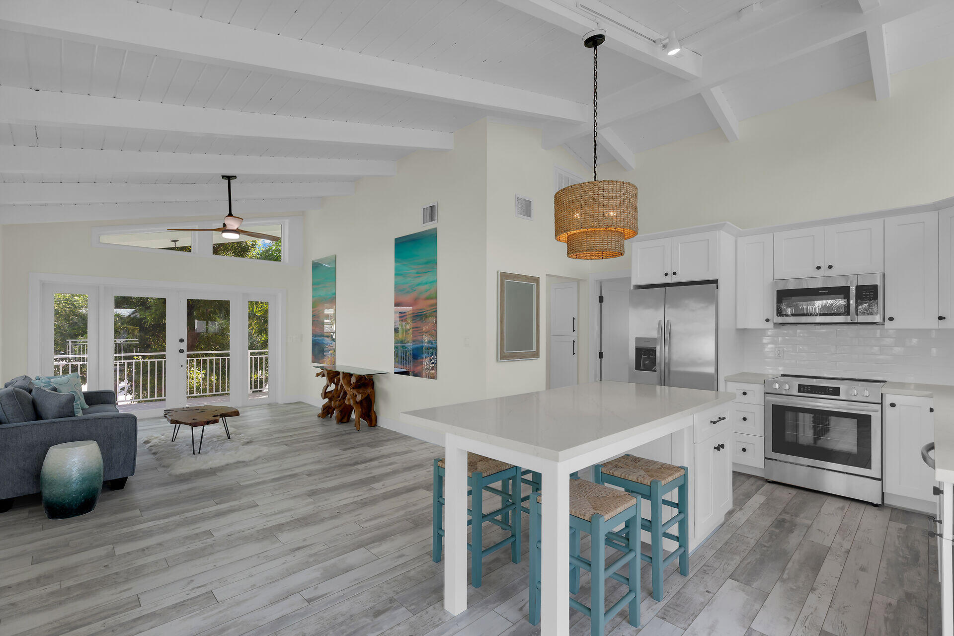 147 Sioux Street Tavernier, FL 33070 - Photo 9 of 41 a view of a kitchen with a sink microwave and cabinets