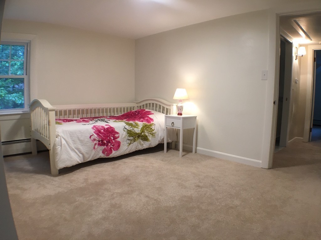 71 Stonebridge Road Wayland, MA 01778 - Photo 15 of 23 a bedroom with a bed and a window