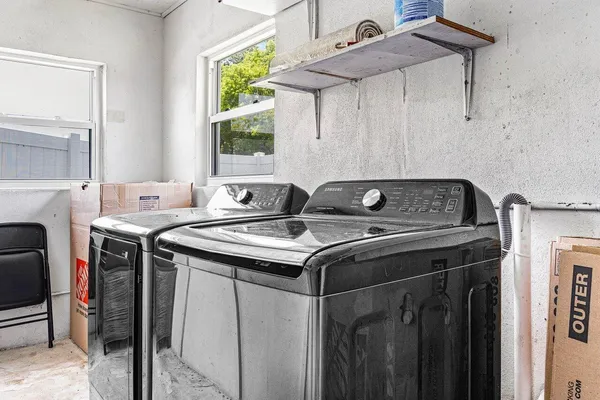 a utility room with dryer and washer