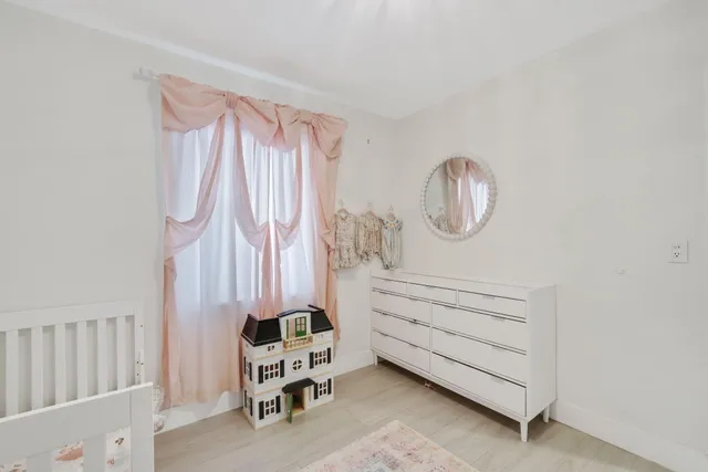 a white tub sitting next to a white sink