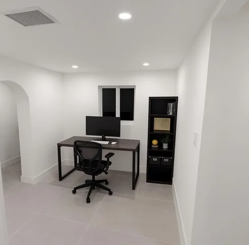 a view of a house with swimming pool and sitting area