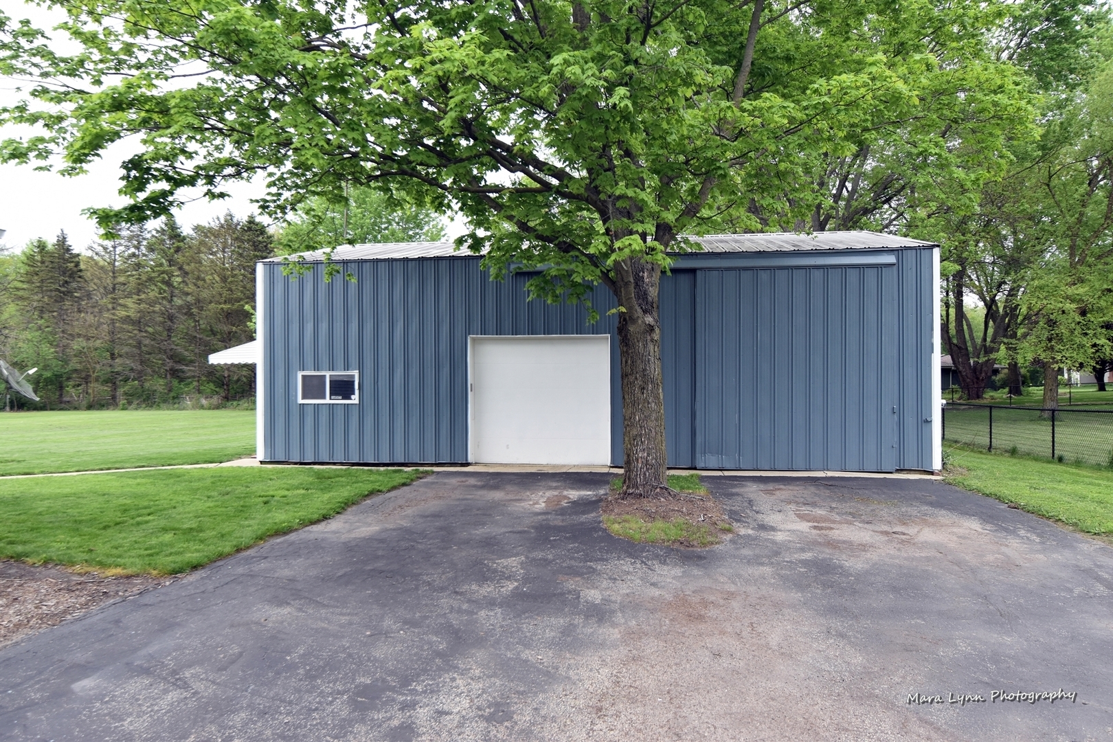 2S643 Nelson Lake Road Batavia, IL 60510 - Photo 40 of 48 a view of backyard with large trees and wooden fence