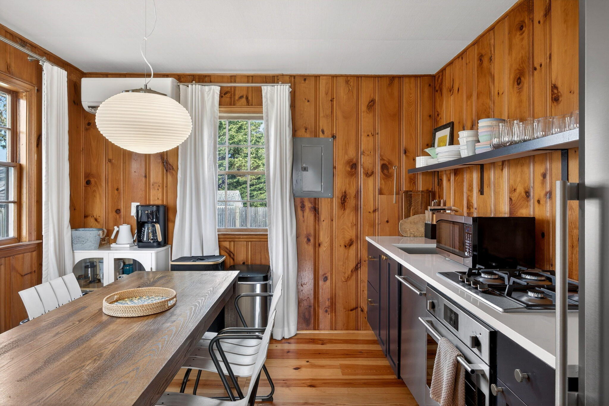 6 Manning Road Dennis Port, MA 02639 - Photo 15 of 53 a kitchen with sink refrigerator dining table and chairs