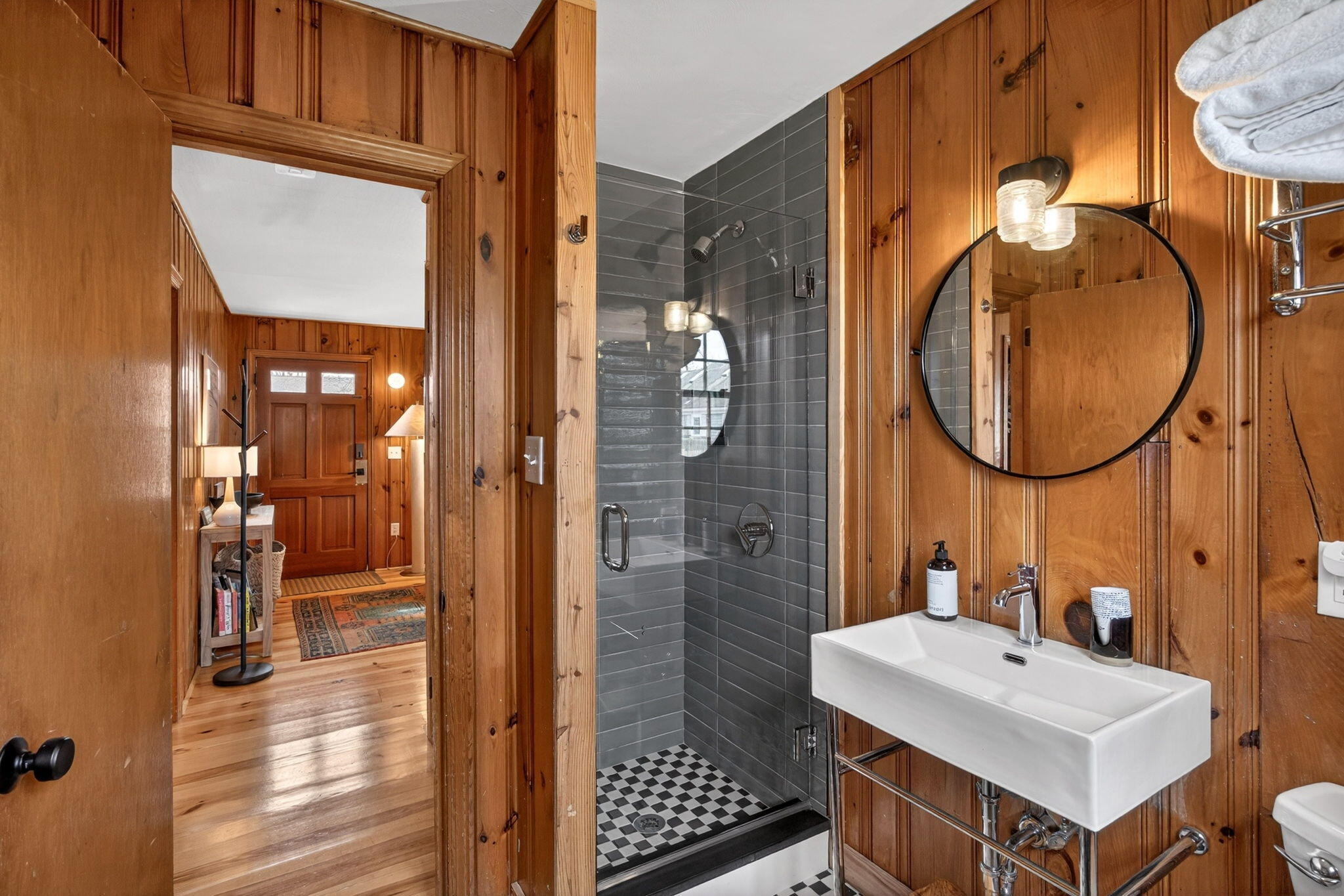 6 Manning Road Dennis Port, MA 02639 - Photo 26 of 53 a bathroom with a sink a mirror and a shower