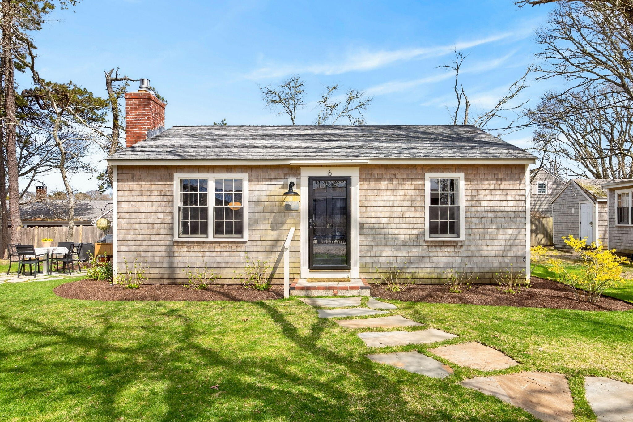 6 Manning Road Dennis Port, MA 02639 - Photo 34 of 53 a front view of a house with a yard