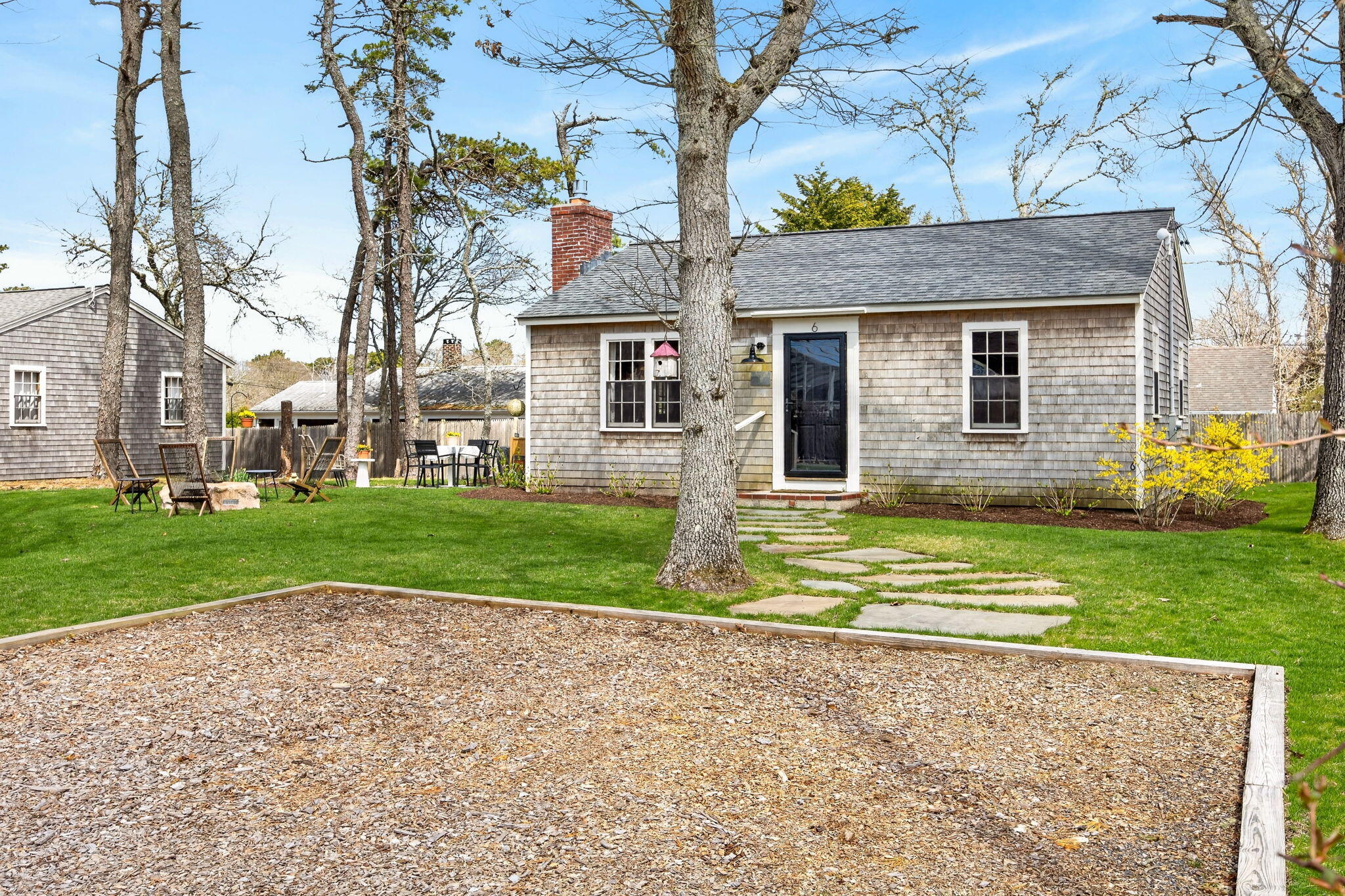 6 Manning Road Dennis Port, MA 02639 - Photo 35 of 53 a view of a house with a yard