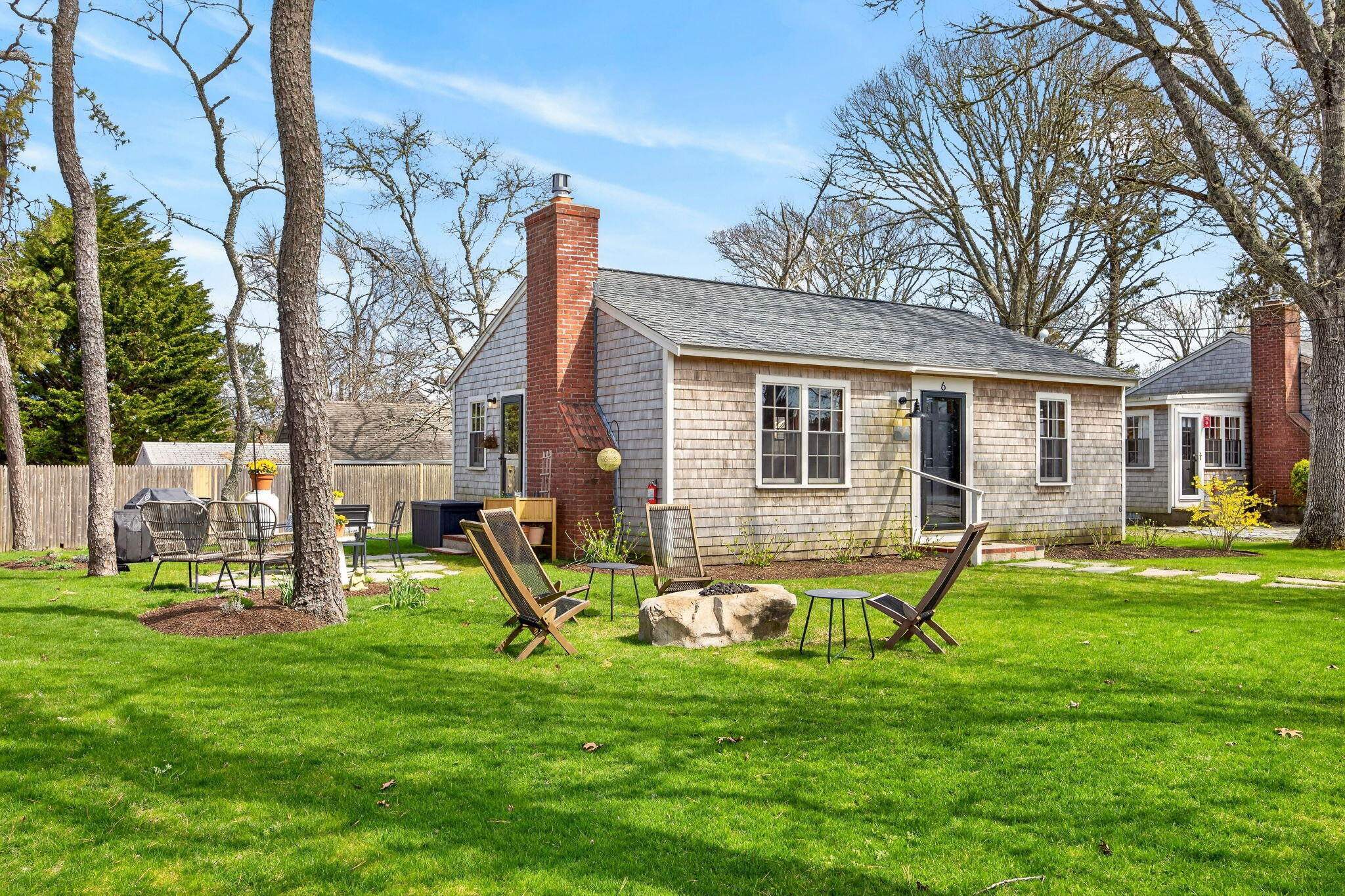 6 Manning Road Dennis Port, MA 02639 - Photo 36 of 53 a front view of house with a garden and trees