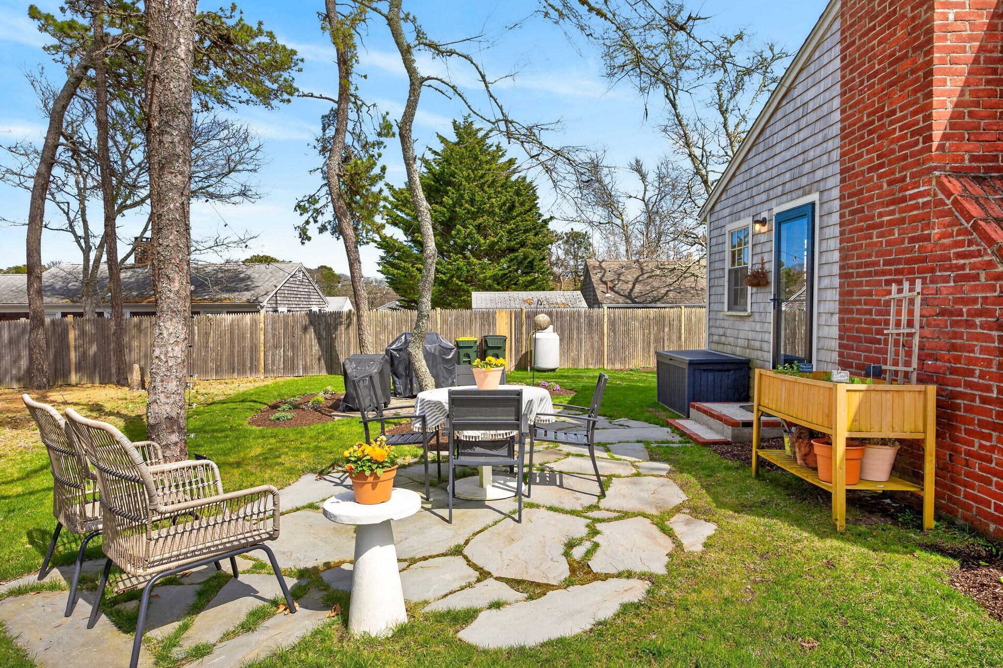 6 Manning Road Dennis Port, MA 02639 - Photo 37 of 53 a backyard of a house with table and chairs
