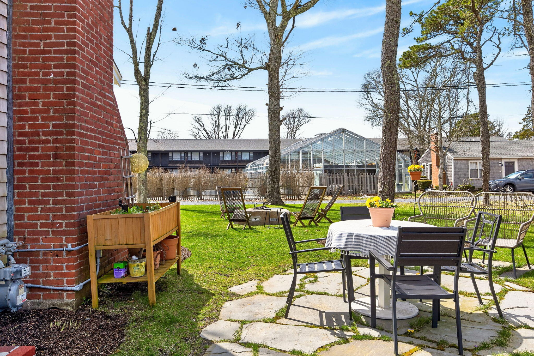 6 Manning Road Dennis Port, MA 02639 - Photo 40 of 53 a backyard of a house with outdoor seating