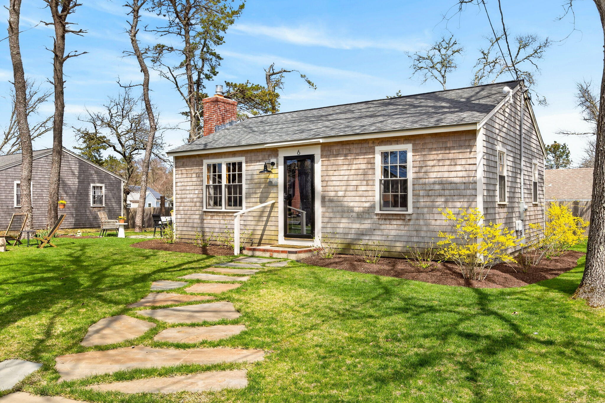 6 Manning Road Dennis Port, MA 02639 - Photo 4 of 53 a front view of a house with a yard