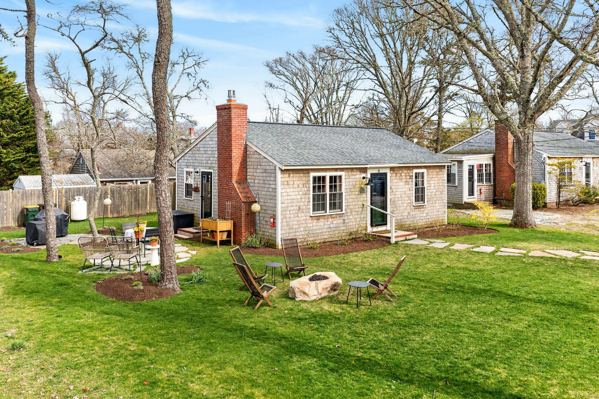 6 Manning Road Dennis Port, MA 02639 - Photo 41 of 53 a view of a house with a backyard porch and sitting area