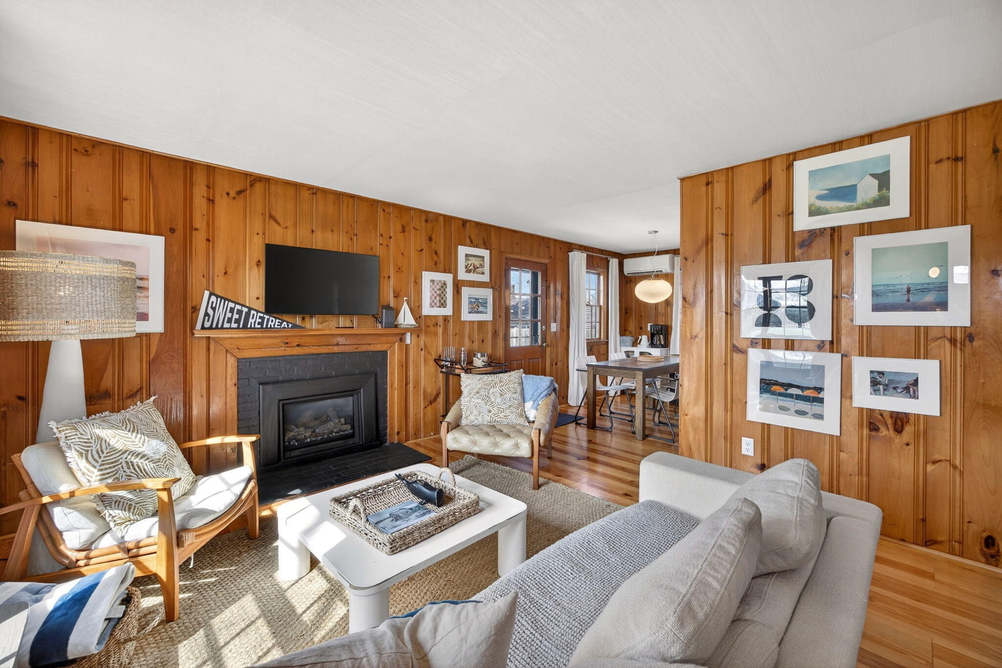 6 Manning Road Dennis Port, MA 02639 - Photo 5 of 53 a living room with furniture a fireplace and a flat screen tv