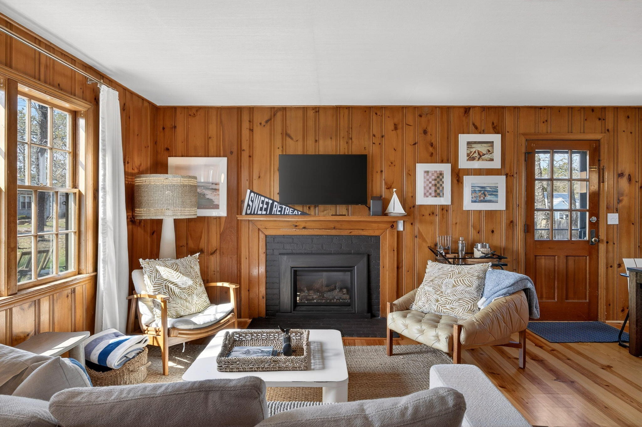 6 Manning Road Dennis Port, MA 02639 - Photo 6 of 53 a living room with furniture and a fireplace