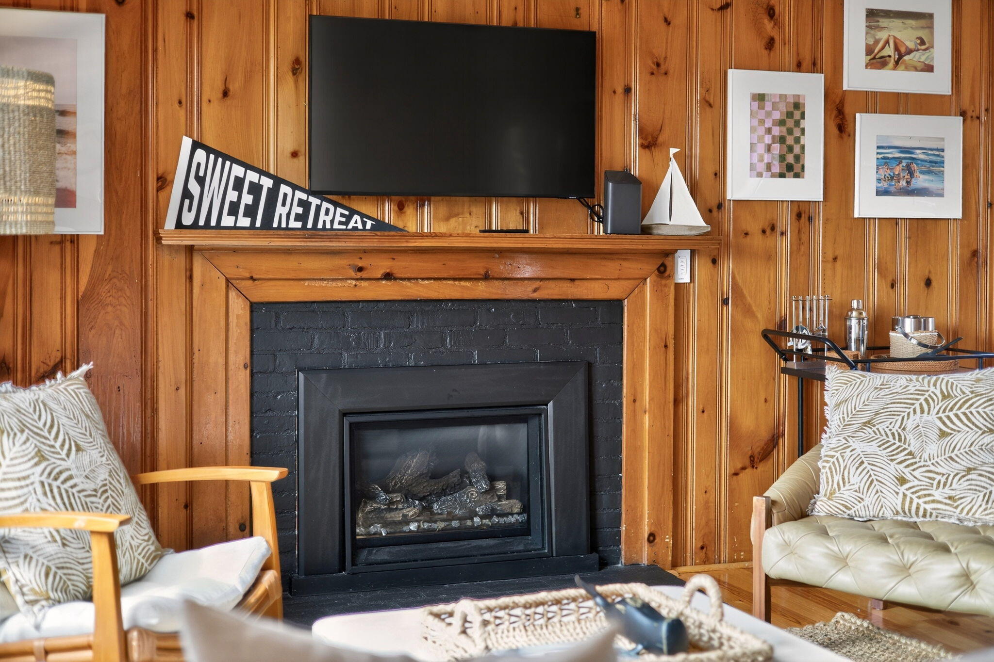 6 Manning Road Dennis Port, MA 02639 - Photo 7 of 53 a living room with a fireplace and a flat screen tv