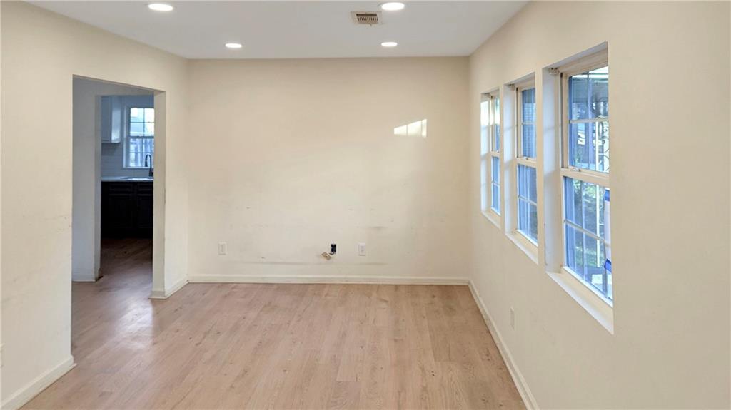 3340 Pinehill Drive Decatur, GA 30032 - Photo 5 of 15 wooden floor in an empty room with a window