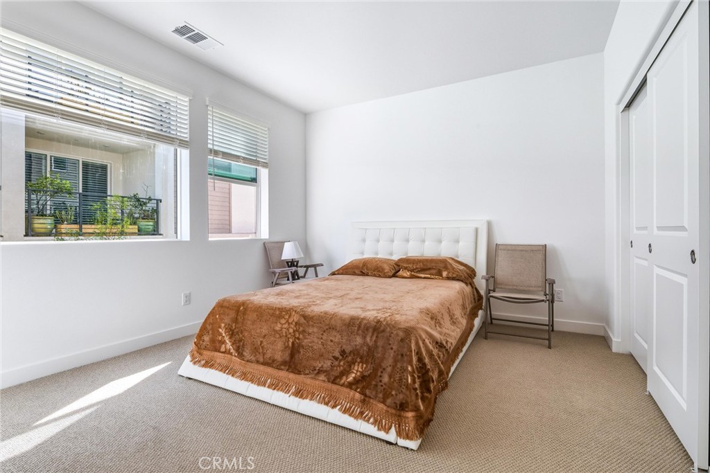 26767 Laurel Mountain Loop Valencia, CA 91381 - Photo 18 of 43 a bed sitting in a bedroom next to a window