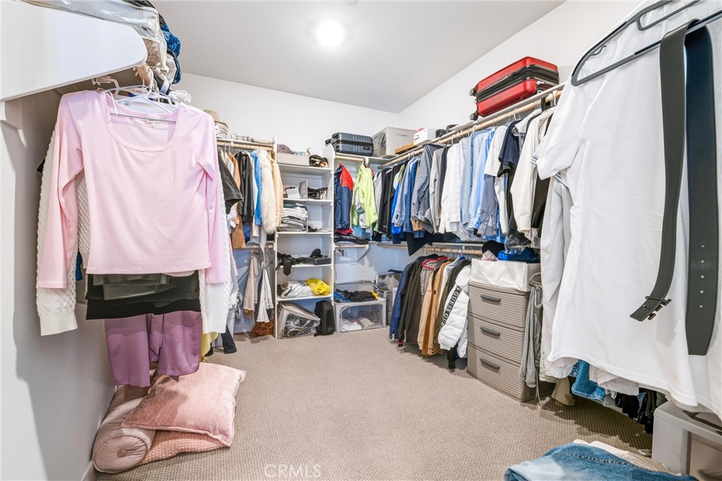26767 Laurel Mountain Loop Valencia, CA 91381 - Photo 25 of 43 a view of walk in closet with clothes and shoes