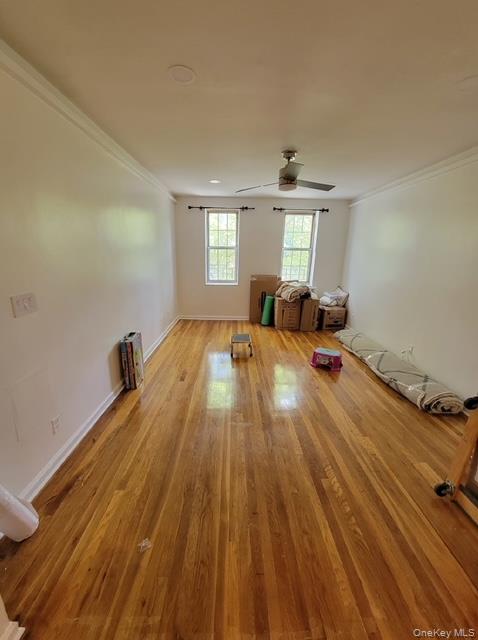 780 Bronx River Road, Unit A52 Yonkers, NY 10708 - Photo 5 of 6 a spacious bedroom with a bed and wooden floor