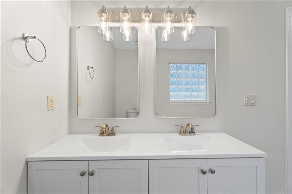 7815 Ridge Top Terrace Douglasville, GA 30134 - Photo 11 of 31 a bathroom with a sink vanity and a mirror