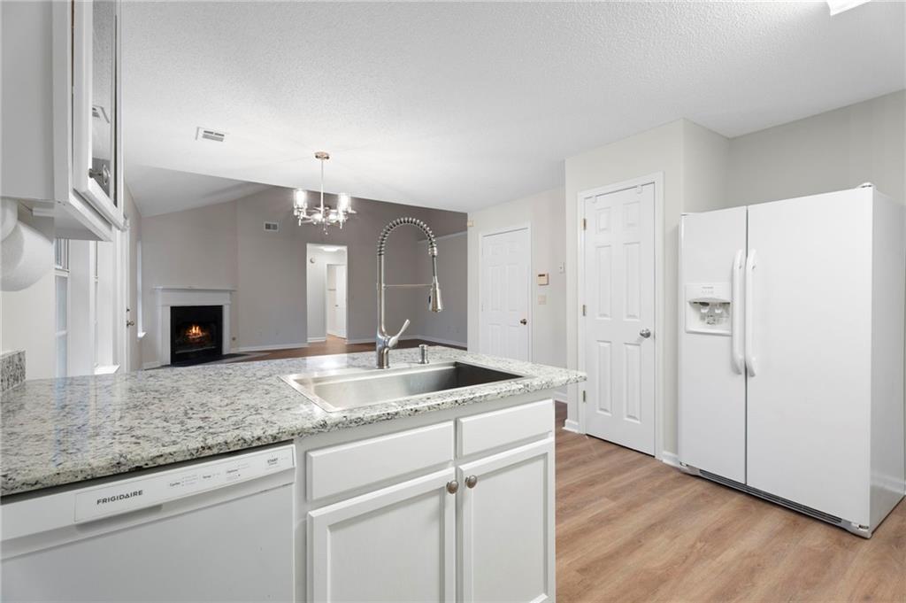 7815 Ridge Top Terrace Douglasville, GA 30134 - Photo 19 of 31 a bathroom with a granite countertop sink and a mirror